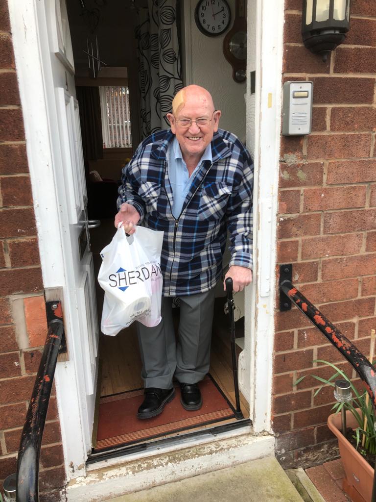 resident receives delivery from sheridans Sheridan Lifts deliver food packages to the vulnerable